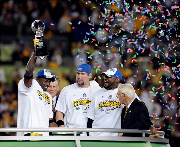 from left, Santonio Holmes, who scored the winning touchdown and was named the most valuable player, quarterback Ben Roethlisberger, Coach Mike Tomlin and Dan Rooney, owner of the Steelers